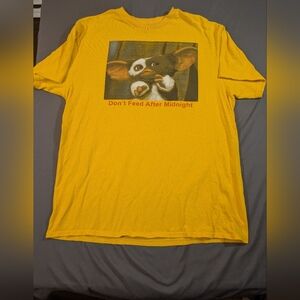 Playful Yellow Cat T-Shirt with Gizmo Design